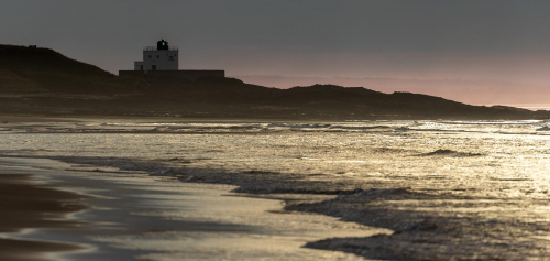 Sunset on Bamburgh Beach by Mike Rowlinson